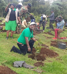 Dr. Mutitu leading community in planting tree saplings at Sasumua watershed